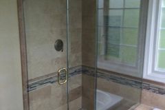Frameless door notch panel with return panel. In an Ashburn VA bathroom done by Ryan Rehp remodeling.