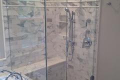 Glass Panel Shower Door On A Tub Deck Installed In Burke.