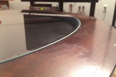 The glass sits beautifully in the grooves of the table. The customer says "I'm so happy with the work!"